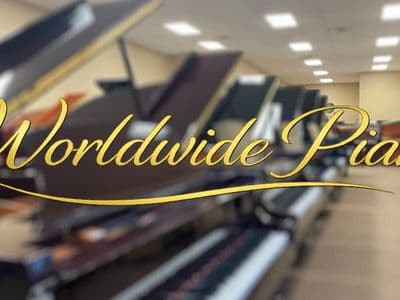 Worldwide Piano logo displayed over a blurred showroom filled with acoustic pianos.