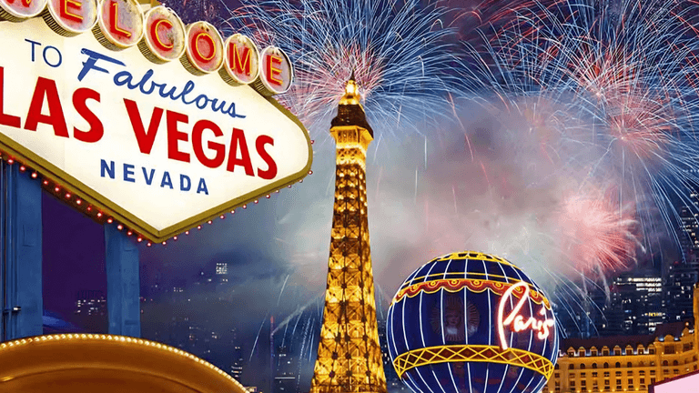 Vibrant Las Vegas skyline with fireworks, iconic sign, Eiffel Tower replica, and a globe decoration