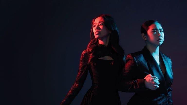 Promotional image for Opera Siam’s Orfeo ed Euridice, showing two performers in dramatic blue and red lighting.