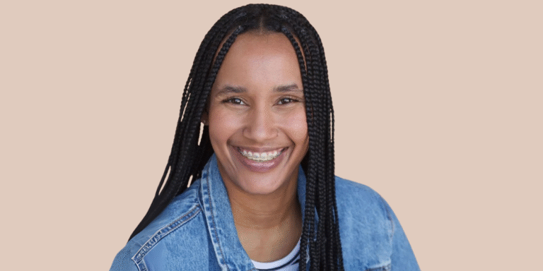 Candyce Denise smiling in a denim jacket, a multi-instrumentalist blending classical, jazz, R&B, and rap in innovative music.