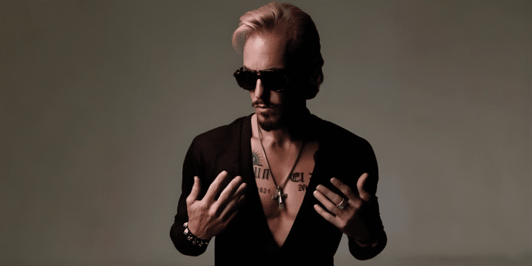 How C.J. Shaman Is Shaping the Future of Rock with Raw Rebellion A rebellious artist, C.J. Shaman, exuding confidence with a bold, rock-inspired look, embodying freedom and raw energy.