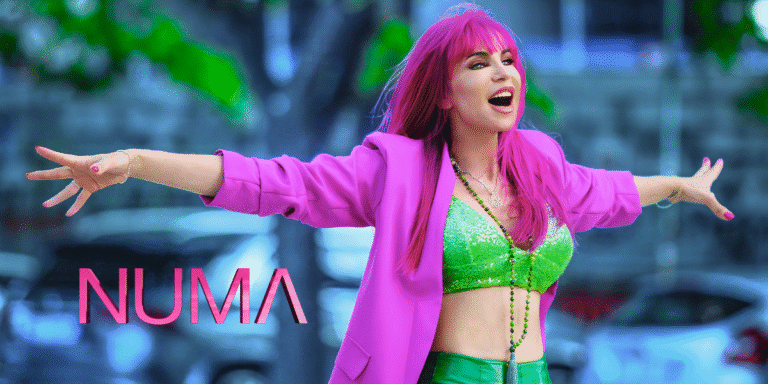 NUMA in vibrant pink and green, embodying empowerment and transformation through music.